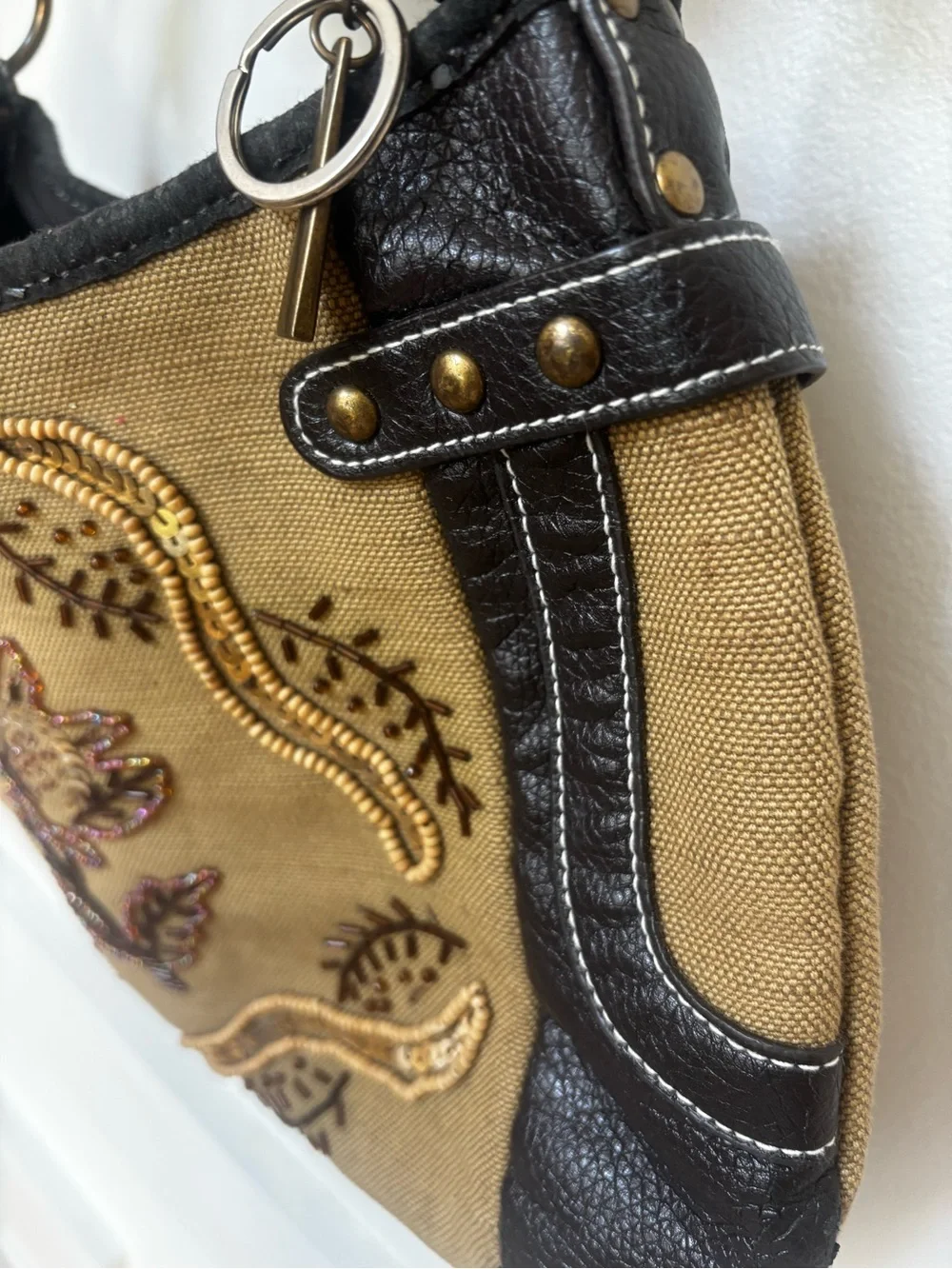 tan canvas and black pebbled leather accented with metallic studs VTG